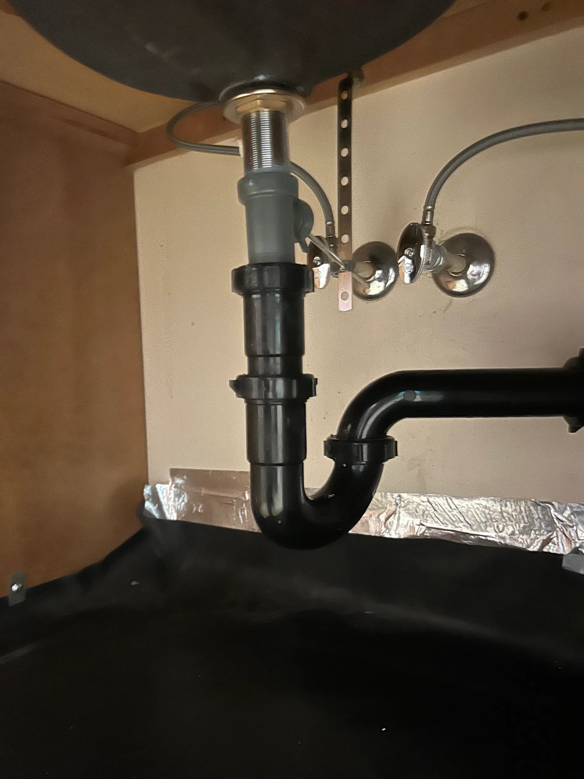 Properly installed P-trap under a bathroom sink by AYSP