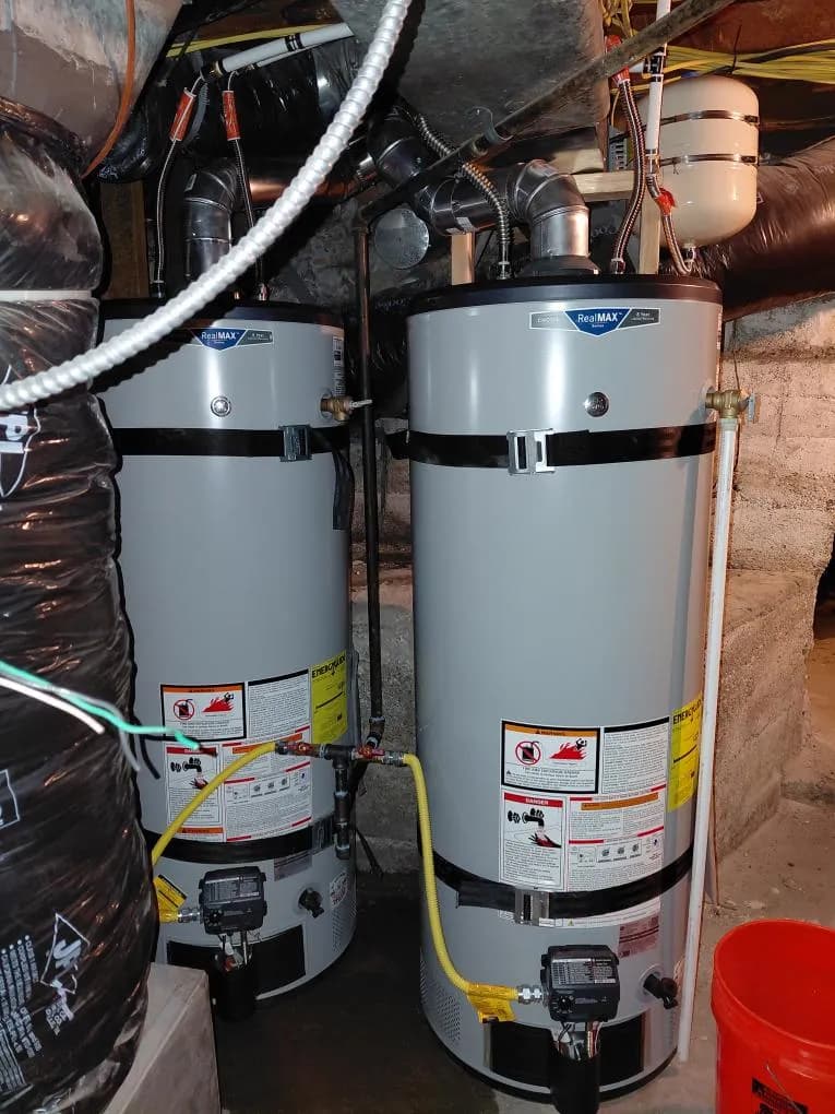 Dual-tank residential water heater install by AYSP plumbers