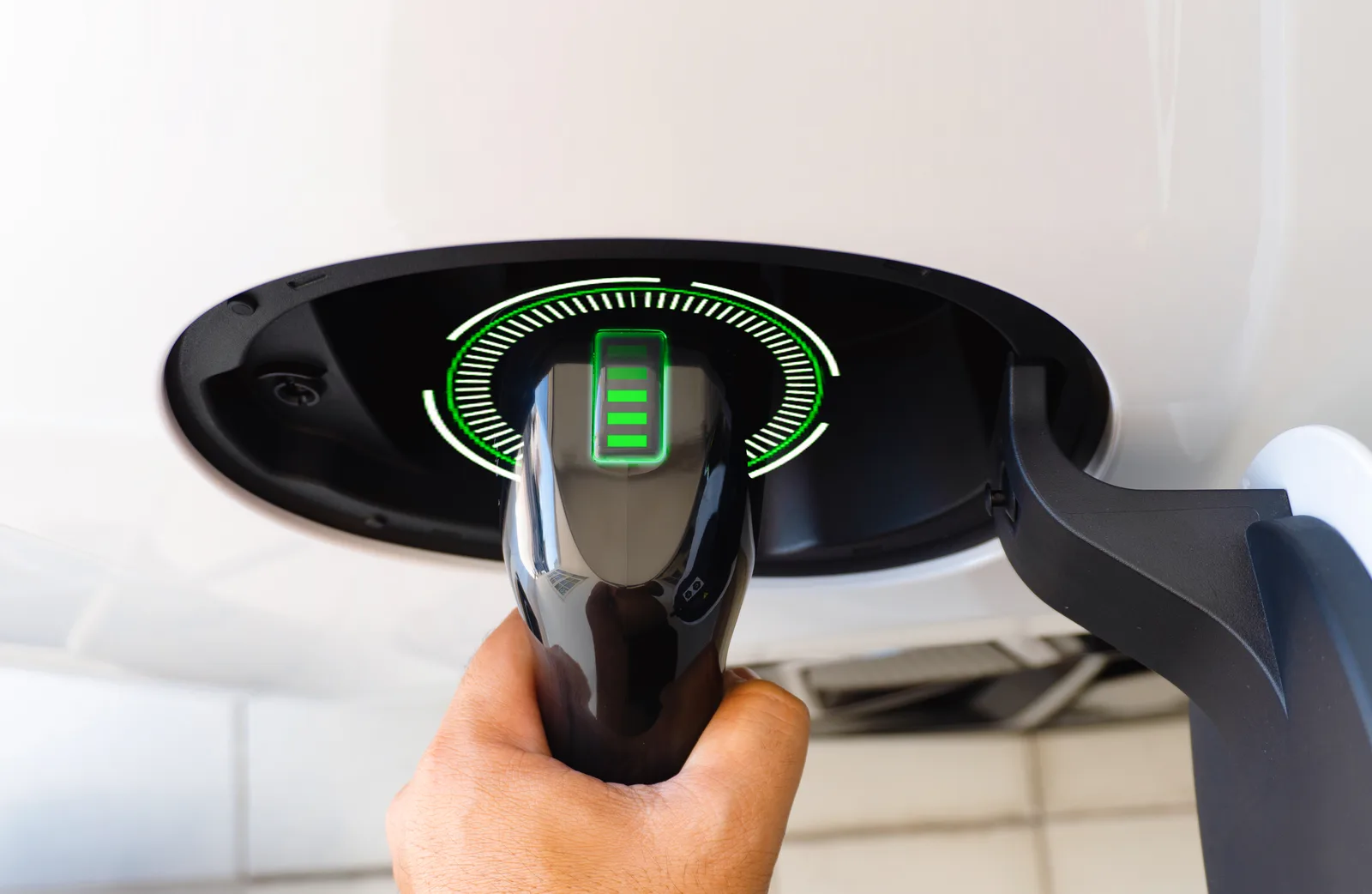 Level 2 EV charger handle plugged into an electric vehicle