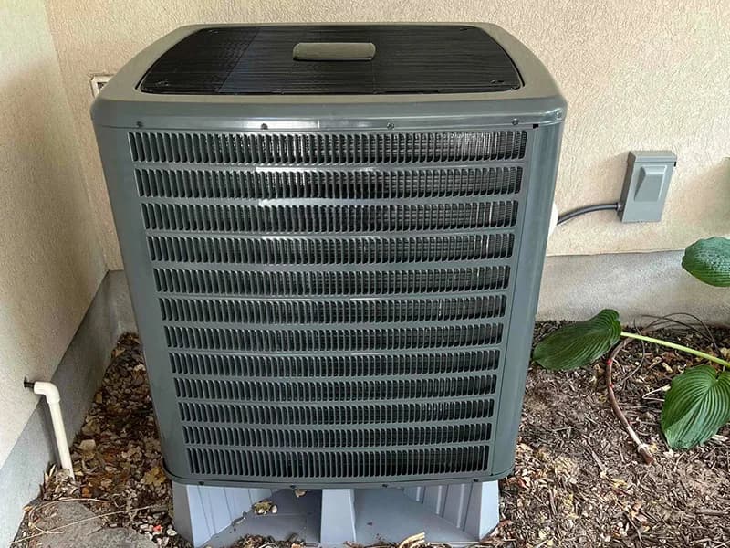 AYSP HVAC technician completing a residential AC condenser install in Utah