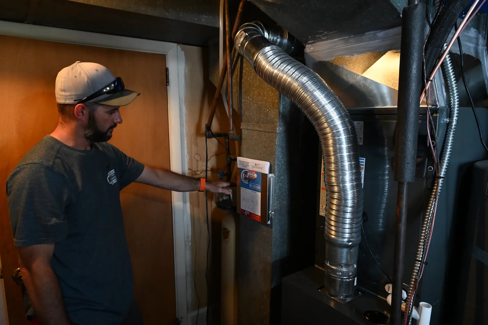Technician inspecting Goodman furnace install