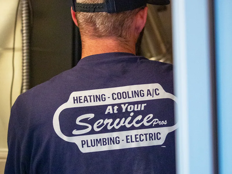 Professional HVAC technician inspecting equipment